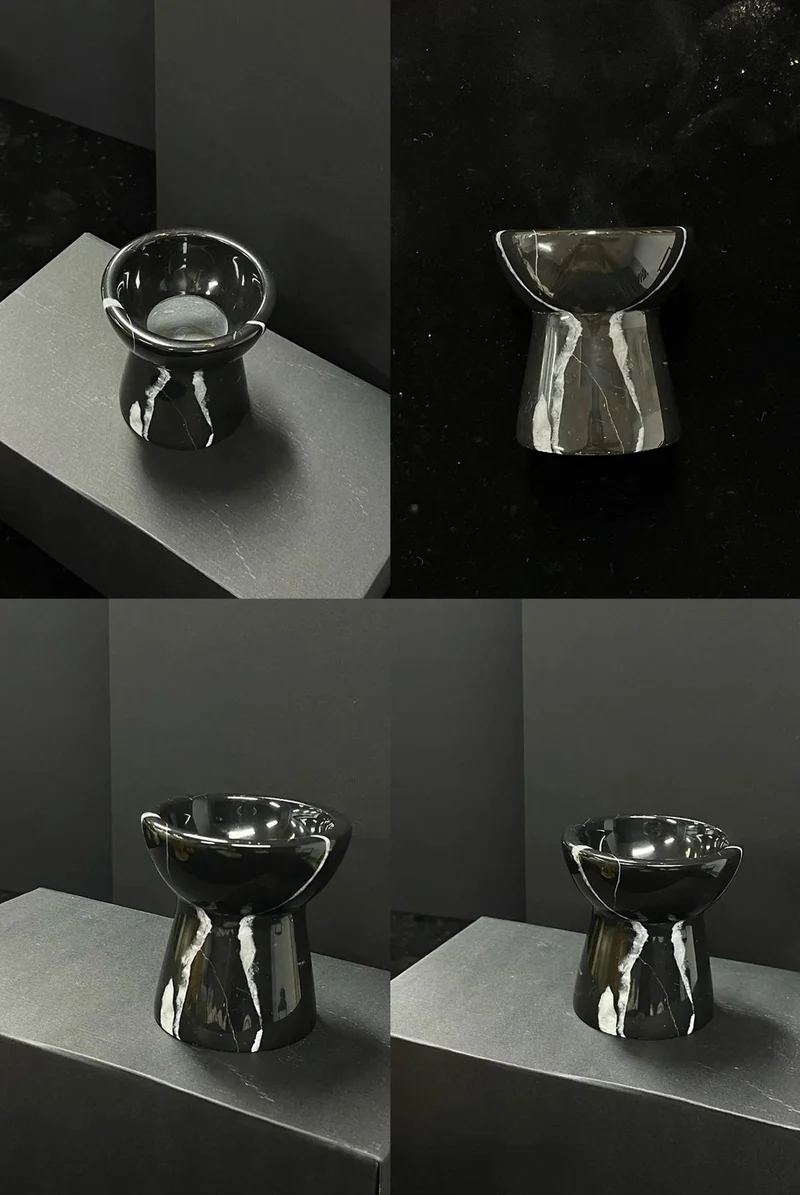 Four views of a black stone holder with contrasting light veins