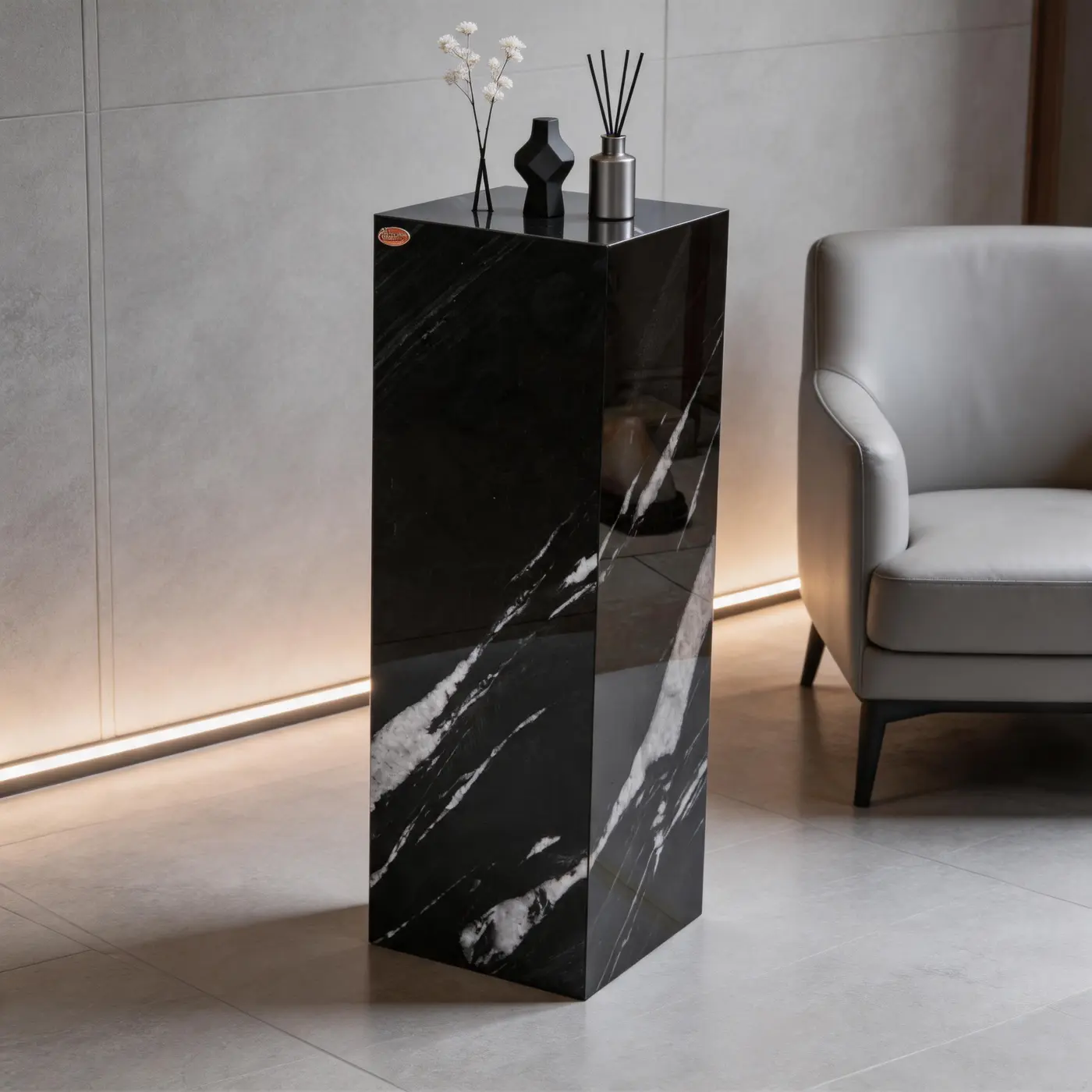 Brazilian Black Gold pedestal beside lounge furniture