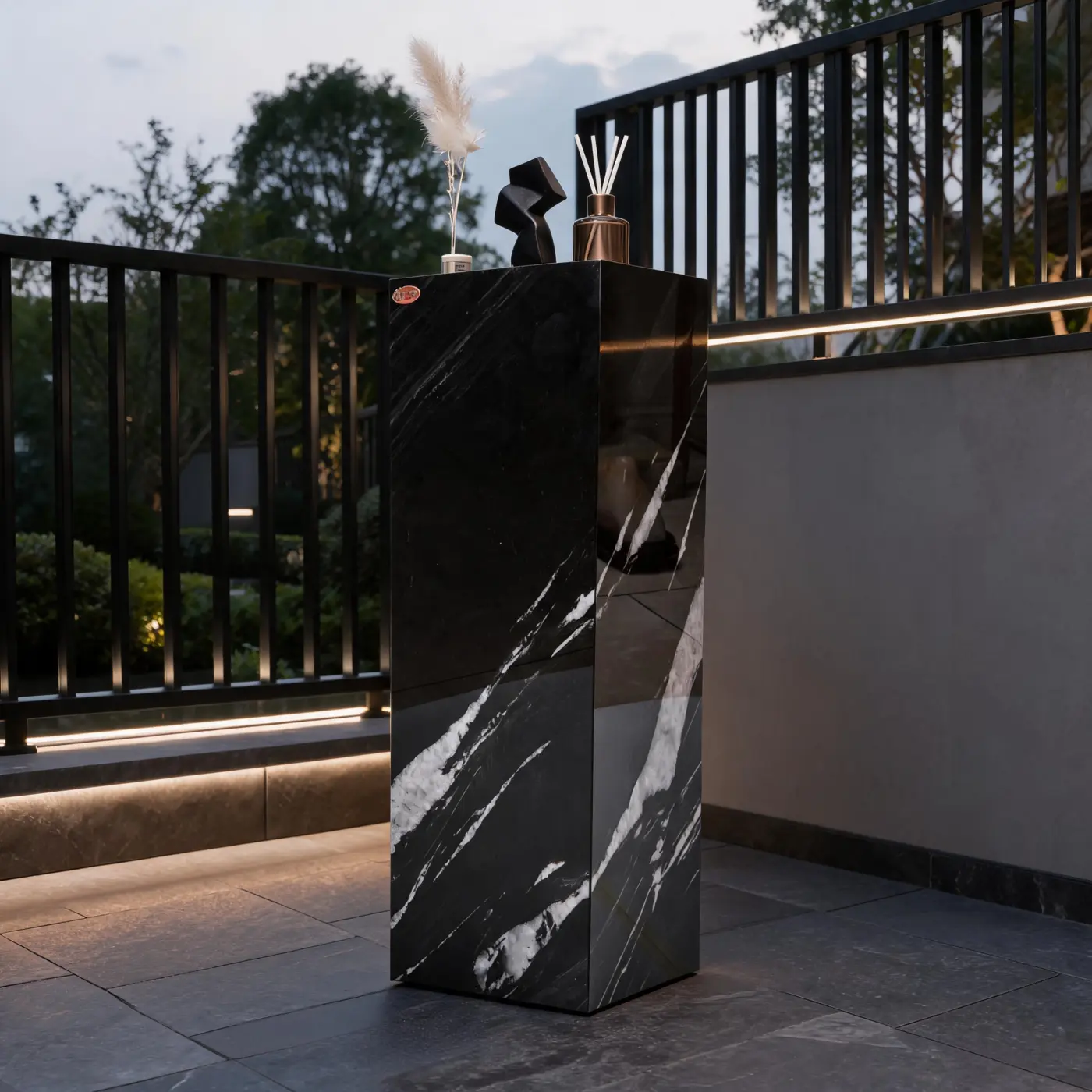 Brazilian Black Gold pedestal in an outdoor setting