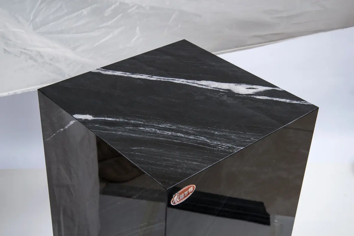Top and mitred corner detail of Brazilian Black Gold pedestal