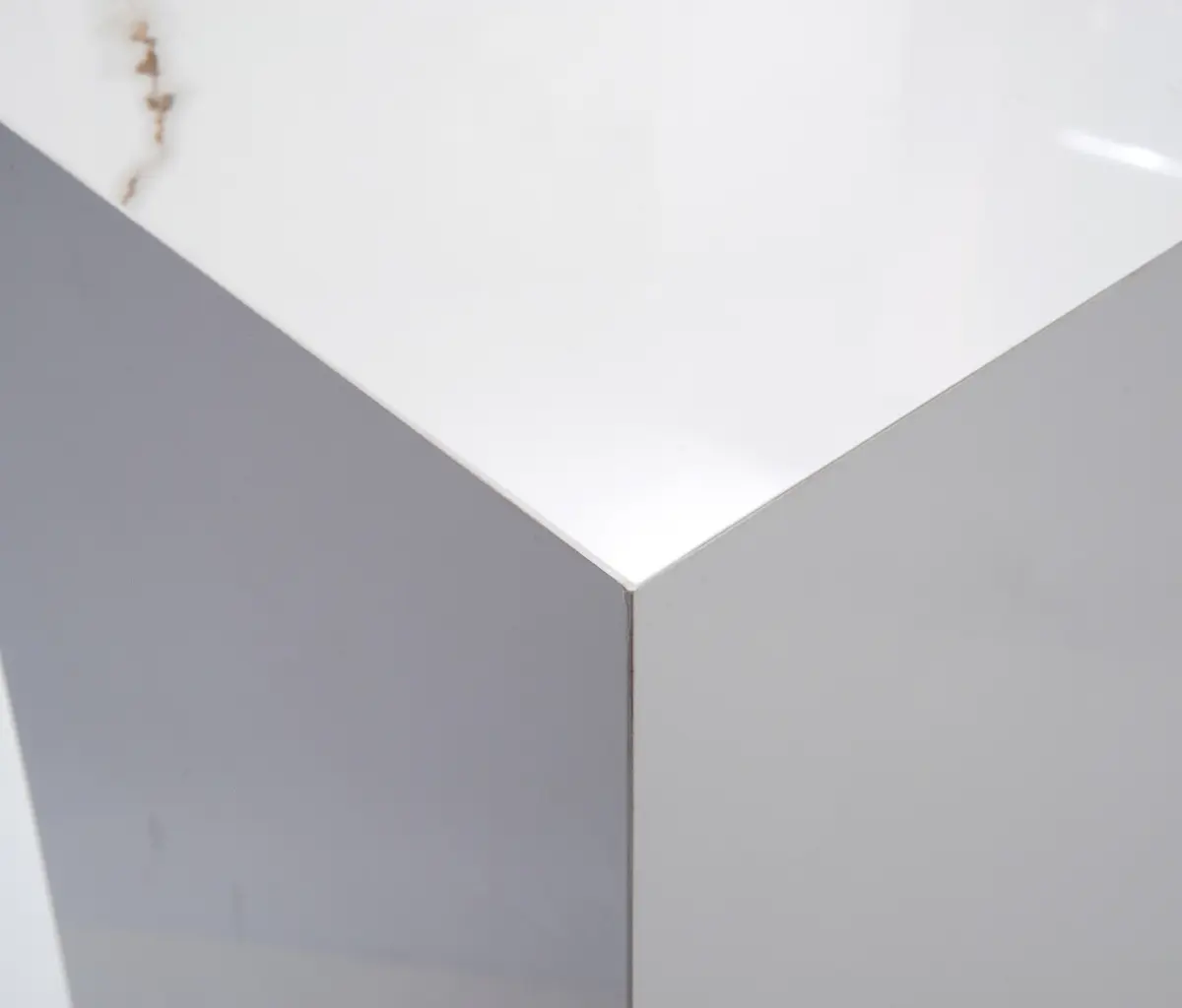Mitred corner of Calacatta Gold pedestal